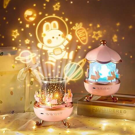 Bunny Carousel Night Light Projector – Rotating LED Lamp with 6 Films, Starry Sky & Galaxy Projection for Kids Room Decor (Rose Gold)